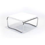 A 1970's white laminate coffee table of square form on chromed tubular supports, by Antocks Lairn,