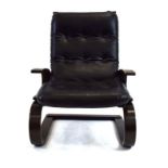 A 1970's black leather and bentwood cantilever armchair