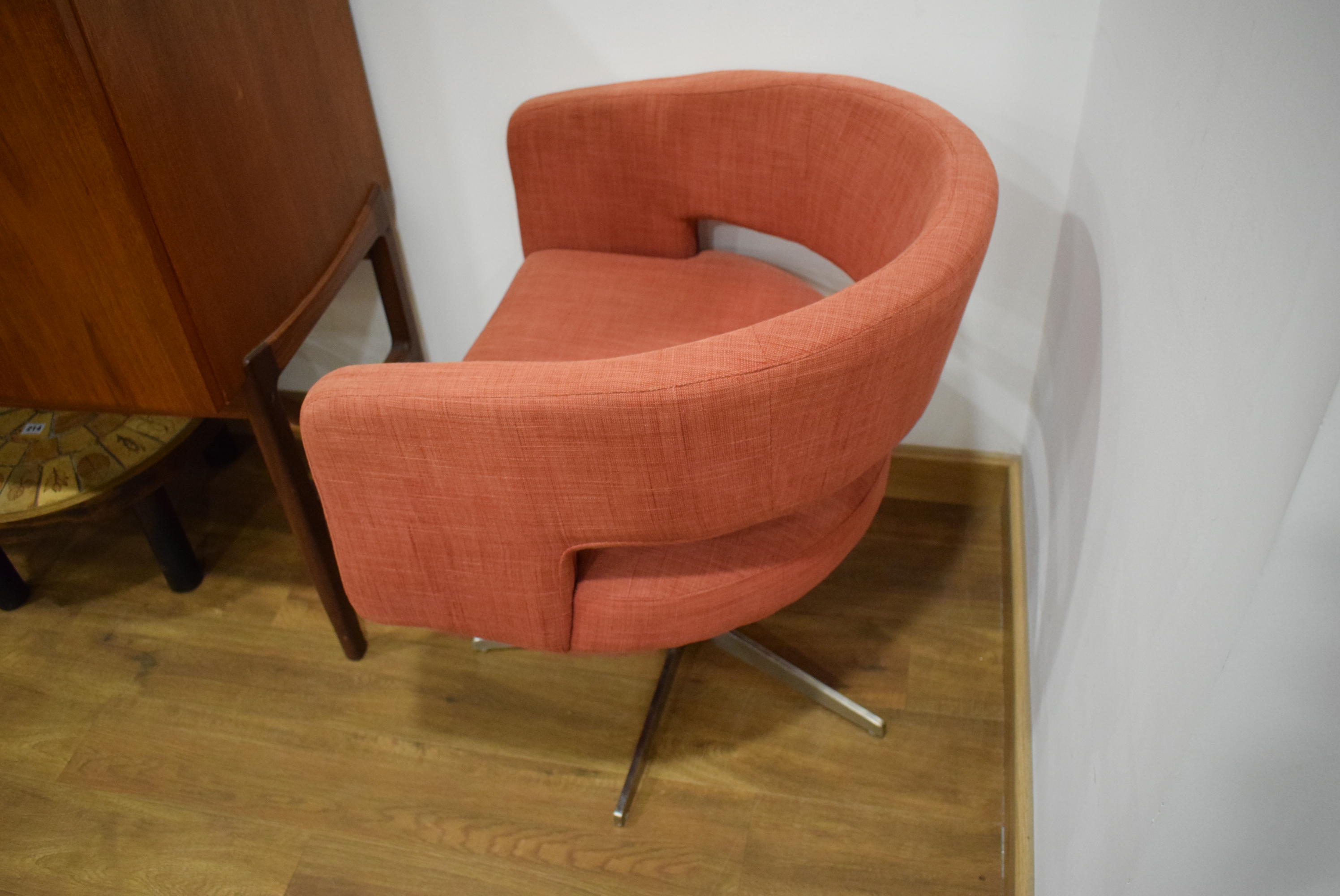 A pair of contemporary Swedish swivel chairs upholstered in pale red cotton on metal five-star - Image 8 of 10