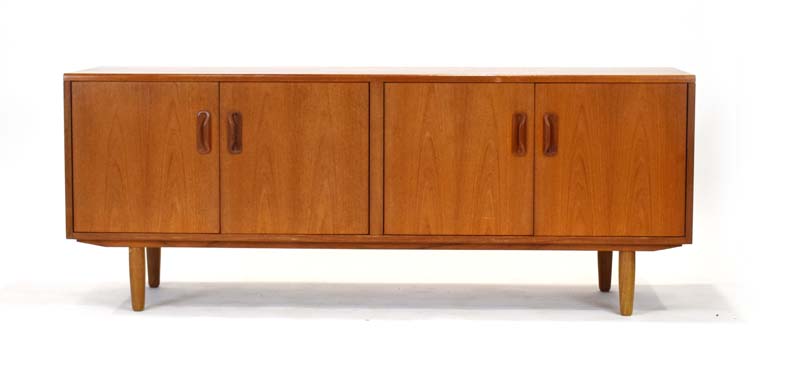 A G-Plan teak four-door sideboard on turned legs, l.