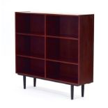 A 1960's Danish rosewood open-fronted bookcase, with four adjustable shelves, on turned legs, w.