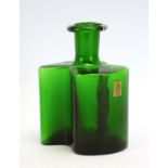 A Holmegaard green glass bottle vase of abstract form