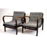 A pair of 1950's Czech armchairs of Art Deco form with stained oak frames and loose grey button