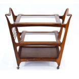Attributed to Giuseppe Scapinelli, a 1960's Brazilian rosewood bar cart/trolley with three tiers,