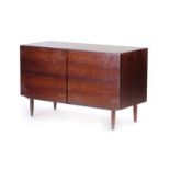 A 1960's Danish rosewood two-door cabinet on turned beech legs, in the manner of Poul Hundevad, w.