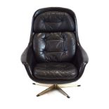 A 1960's black leather button upholstered bucket chair on a five-star base CONDITION