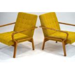 A pair of 1960's Czech armchairs with oak angular all-encompasing frames in yellow striped