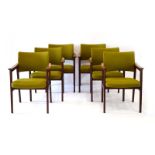 A set of six 1960's Danish rosewood and mahogany arm/desk chairs with green fabric upholstery,