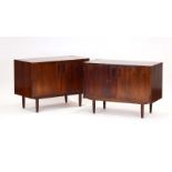 A pair of 1960's Danish rosewood two-door cabinets, on circular beech legs, w.