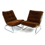 A pair of 1960's loose corduroy and button upholstered chairs on tubular metal frames