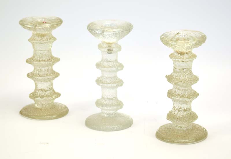 Timo Sarpeneva for Iitala, a set of three Finish moulded glass candlesticks, h.