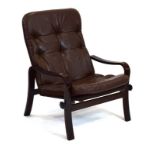 A Danish brown vinyl and button upholstered armchair with a bentwood frame