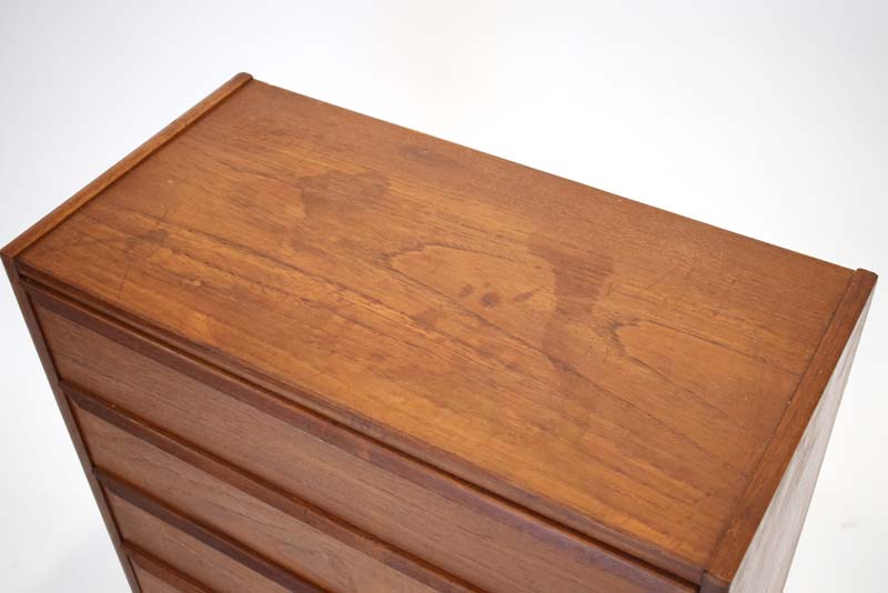 A 1960's teak chest of four drawers with turned handles on beech circular legs, of Danish design, w. - Image 3 of 3