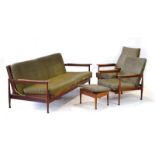 A 1970's teak 'Manhatten' suite upholstered in Harris tweed including a daybed,