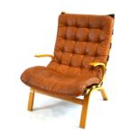A 1970's Danish beech and bentwood 'Siesta' type armchair with tan leather button upholstery