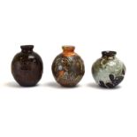 A group of three small studio pottery vases of bulbous form, each signed LH, max. h.