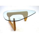 After Isamu Noguchi, a 'Noguchi'-type table, the glass surface resting on an oak base, w.
