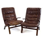 A pair of 1970's Danish bentwood armchairs with loose brown leather upholstery in the manner of