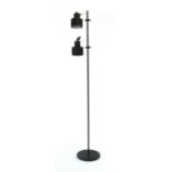 A black enamelled twin-spot standard lamp on a matching shaft CONDITION REPORT:
