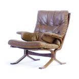 A 1970's brown button upholstered highback lounge armchair on a laminate bentwood frame,