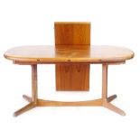 A Danish teak and crossbanded extending dining table with one fitted leaf, designed by H.W.