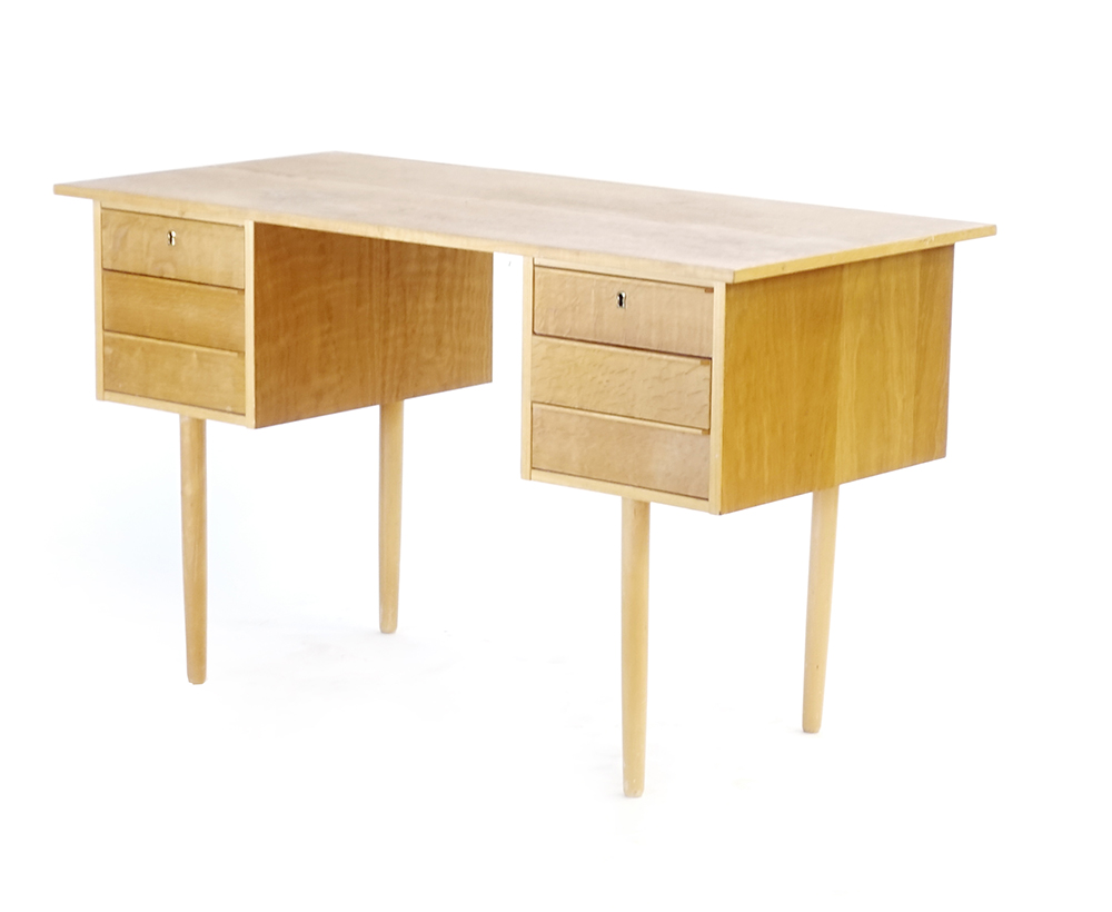 A 1970's oak desk, the rectangular surface over six drawers on tapering beech legs, - Image 2 of 3