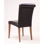 A set of four Poltrona Frau 'Sedia Vittoria' black leather dining chairs
