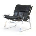 A 1970's chromed and black leather lowback lounge chair,