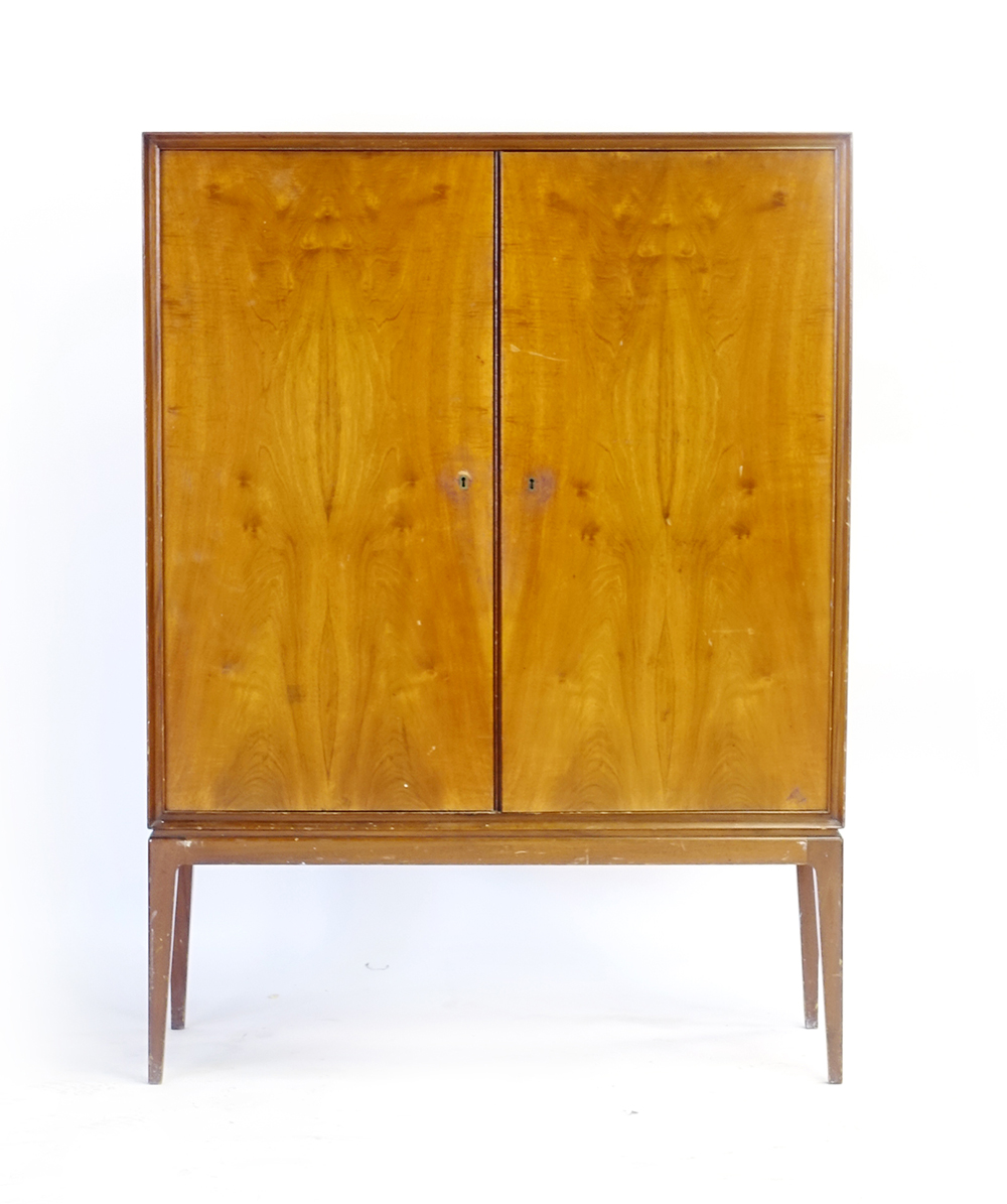 A 1960's walnut finished cabinet, the two doors enclosing shelves and trays, - Image 2 of 16