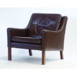 A 1970's brown button upholstered lowback armchair on mahogany square feet CONDITION