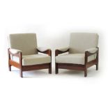 A pair of 1960/70's teak and upholstered armchairs by C.D.