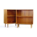 A pair of 1960/70's teak open bookcases, on beech legs, w.