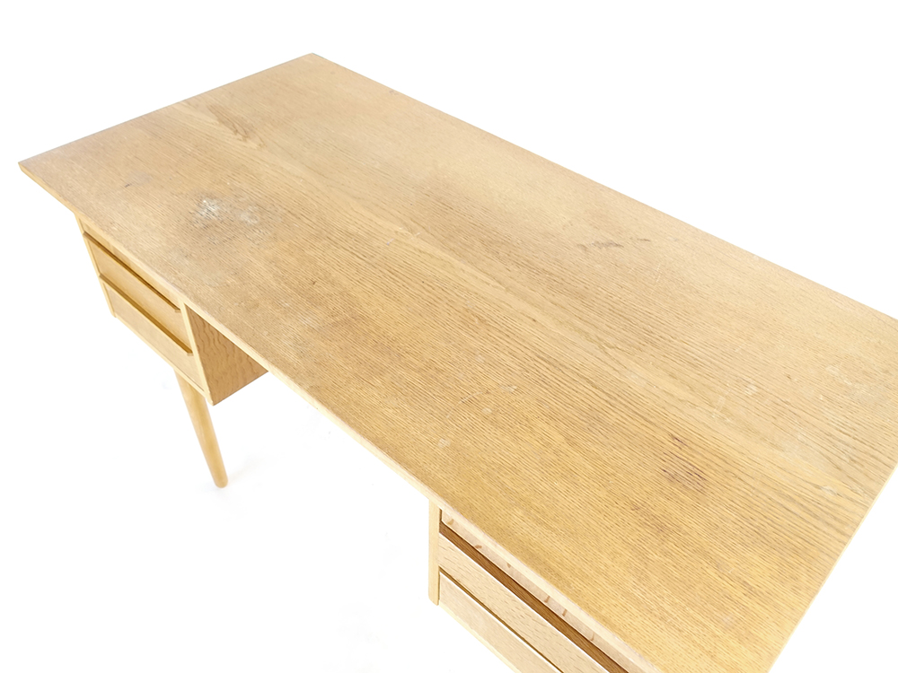 A 1970's oak desk, the rectangular surface over six drawers on tapering beech legs, - Image 3 of 3