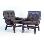 A pair of 1970's brown button upholstered lowback armchairs on bentwood frames,