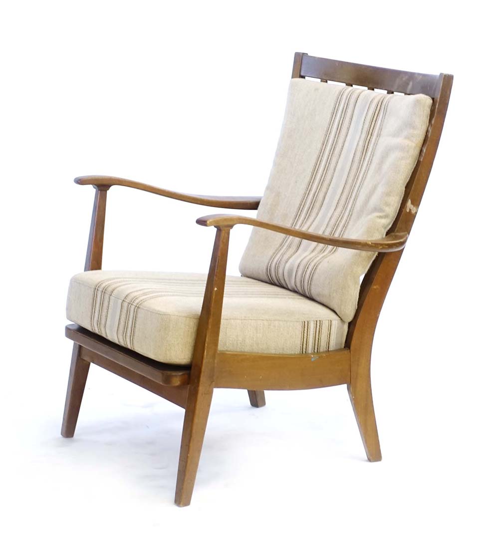 A 1960's beech armchair with loose striped cushions