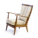 A 1960's beech armchair with loose striped cushions