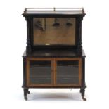 A Victorian ebonised, walnut crossbanded and marquetry music cabinet with a gilt metal gallery,