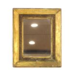 A 19th century gilt plaster wall mirror of rectangular form,