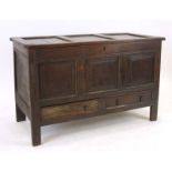 An 18th century oak mule chest, the three panelled front over two drawers,