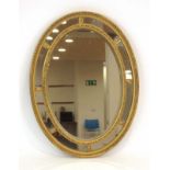 A late 19th/early 20th century gilt and panelled wall mirror,