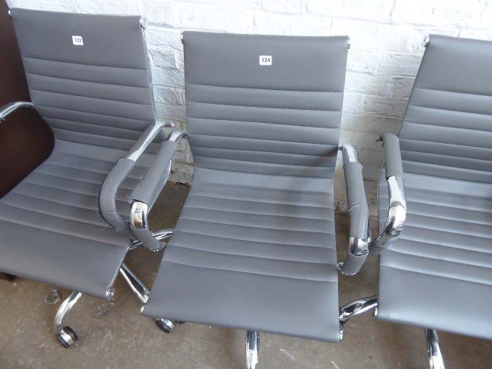 Grey leather effect Eames style swivel chair