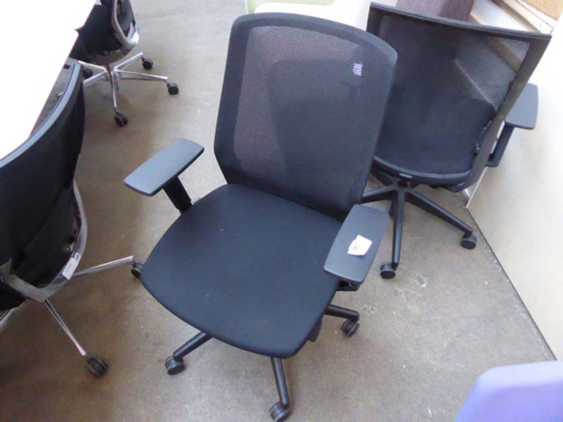 A Bestuhl black cloth and mesh swivel office armchair