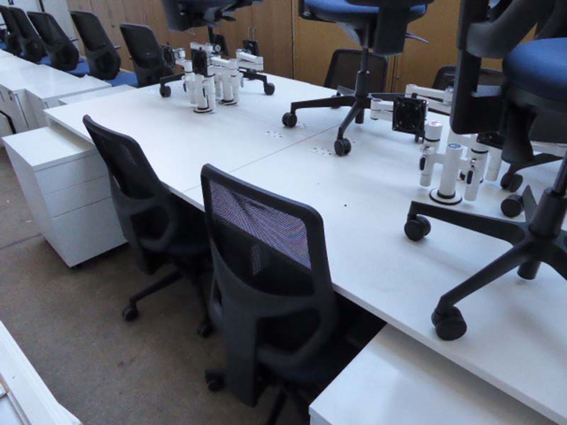 4 person workstation finished in white with metal framed legs and white laminate tops, 280cm x