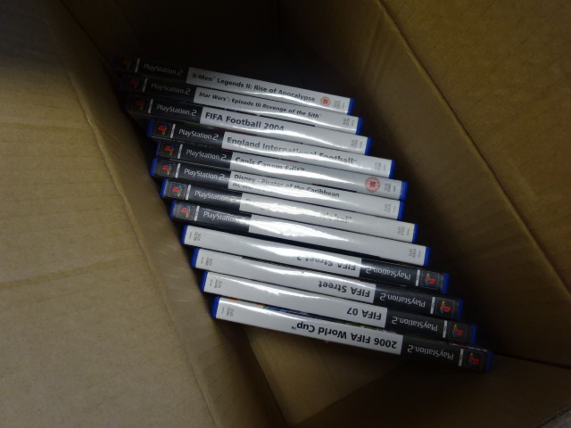 2135 Box containing various Playstation II games