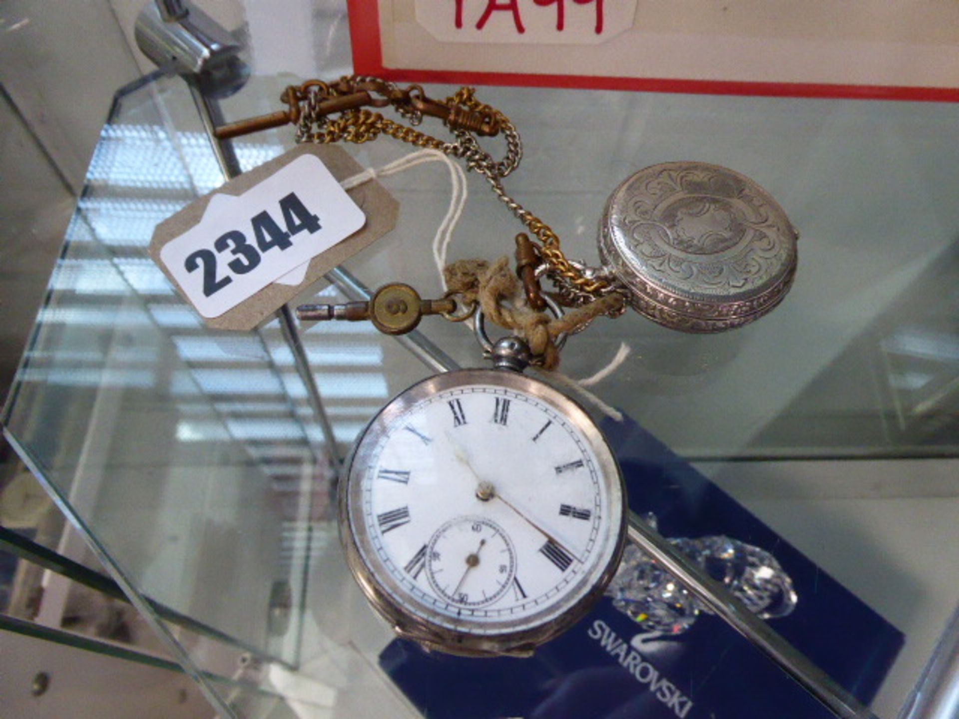 2 pocket watches with keys