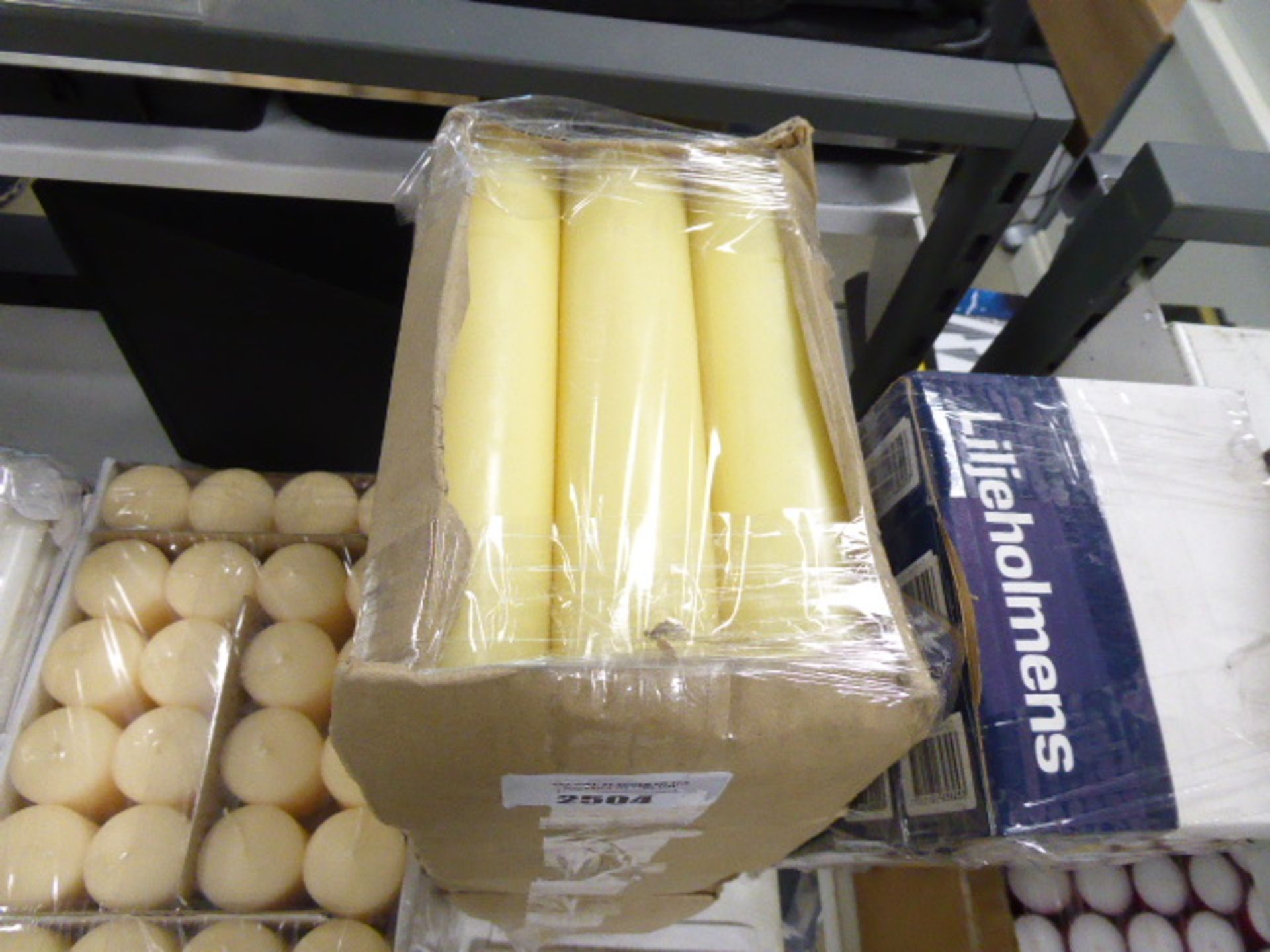 5 packs of various cream coloured candles, approx 24 in pack