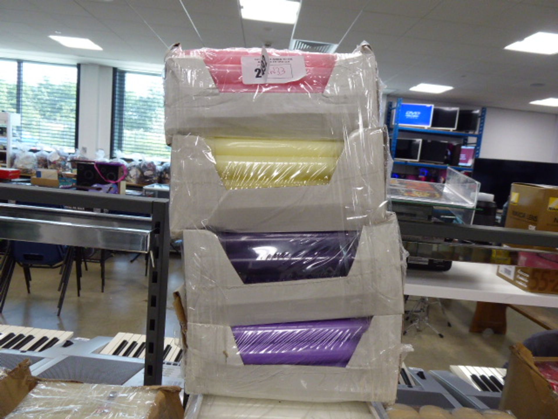 4 boxes of various coloured candles in purple, ivory and pink