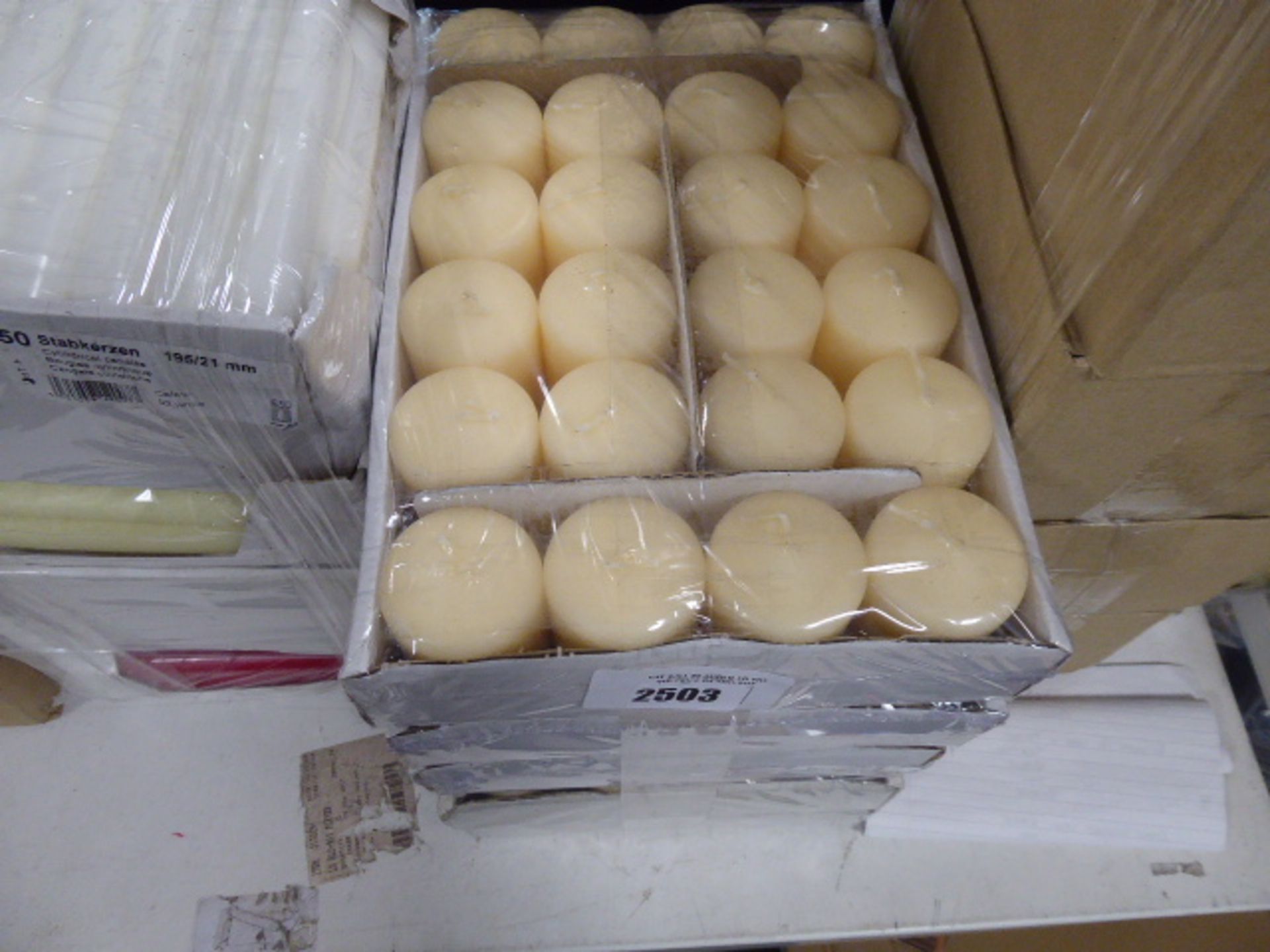 5 packs of various cream coloured candles approx 24 in a pack