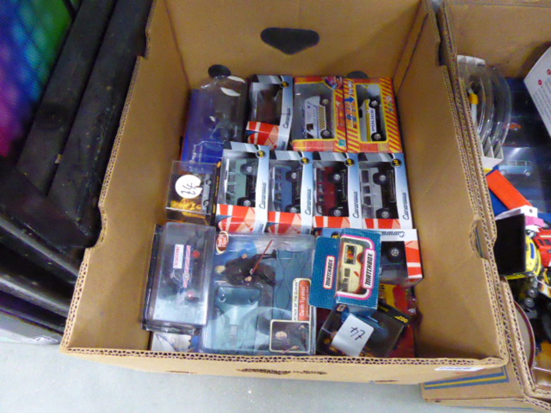 A box containing various die cast vehicles
