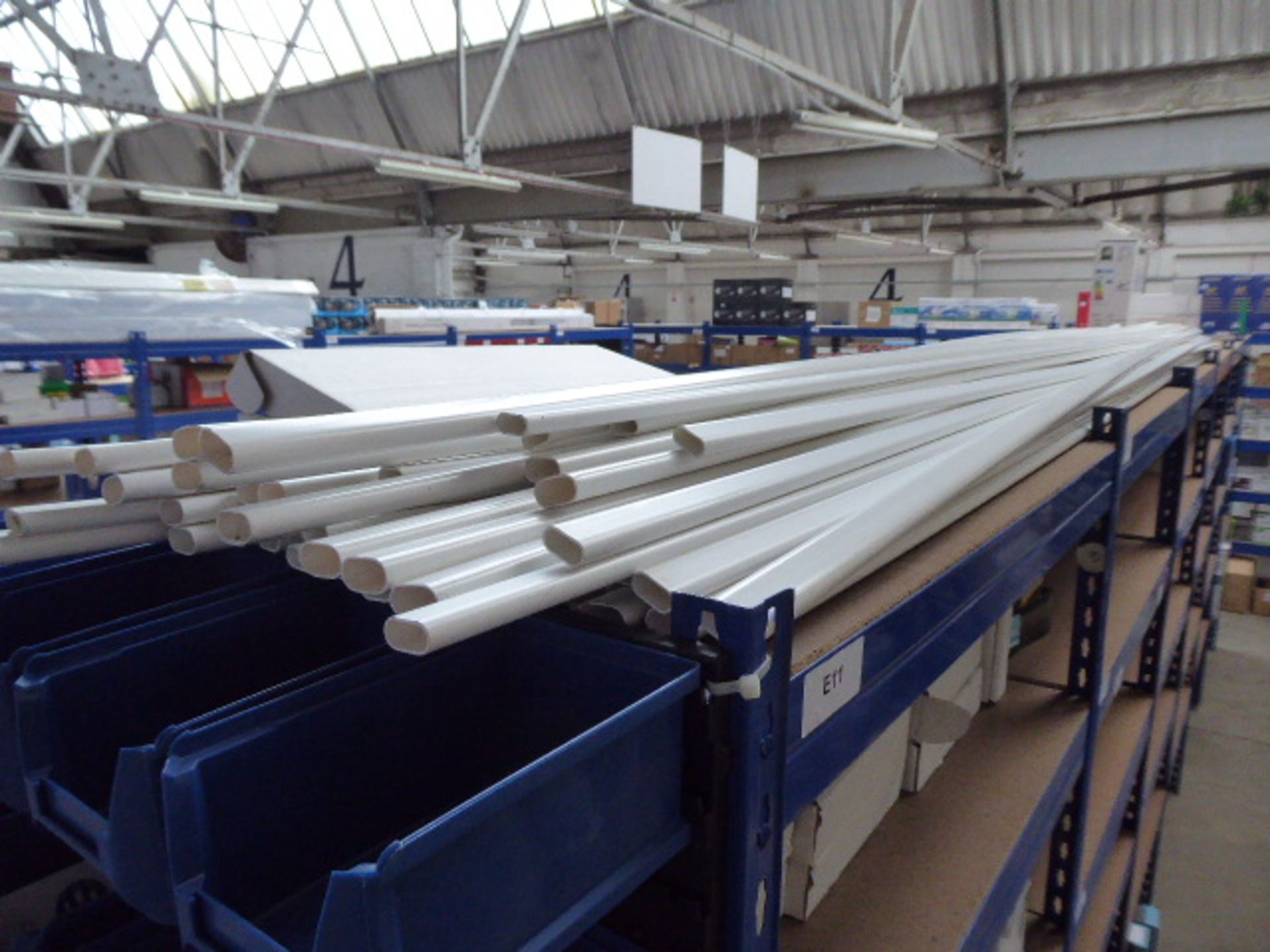 A quantity of loose oval white plastic conduit